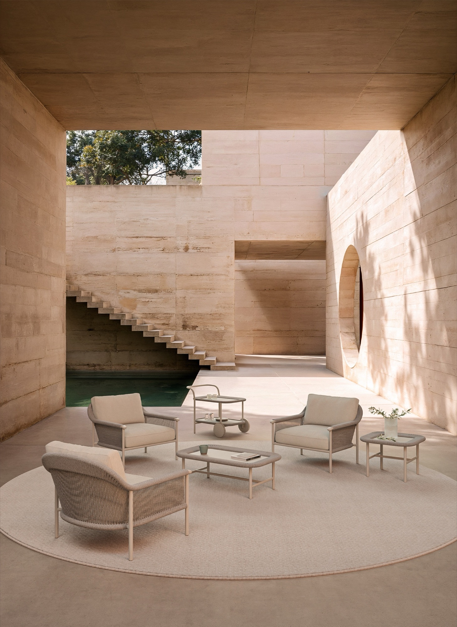 SKLD Studio rope lounge set with armchairs and coffee table on a luxury pool deck